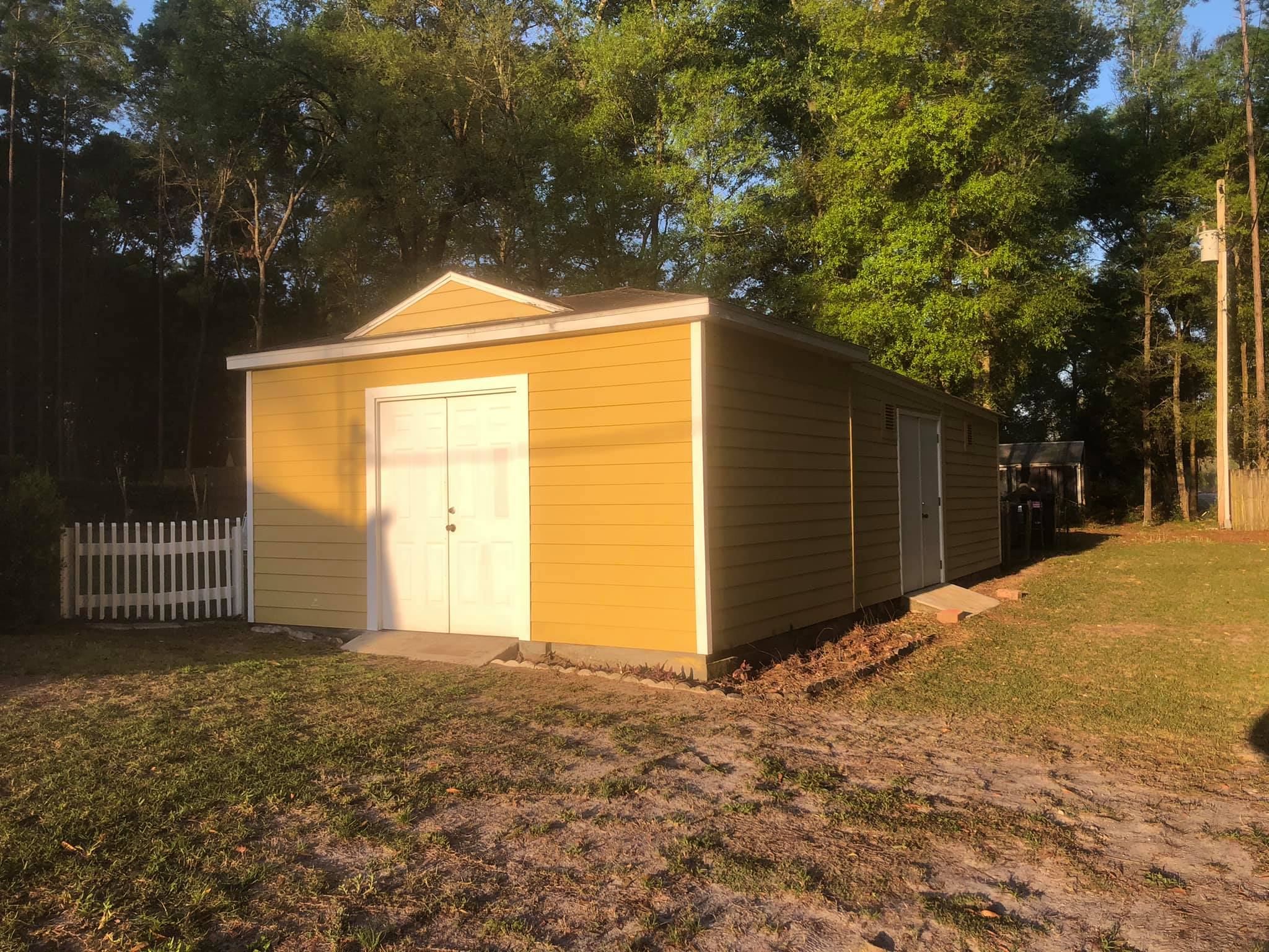 Detached shed before exterior paint and trim refresh