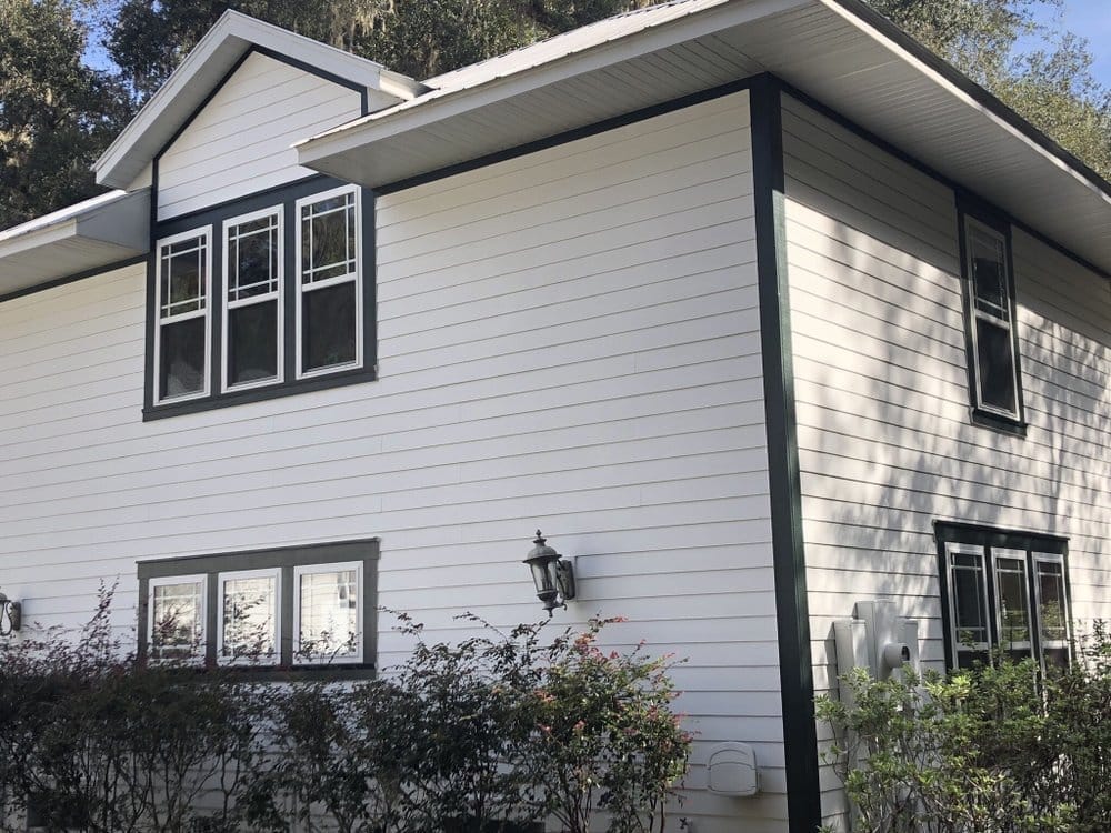 Two-story side after, white with dark green trim