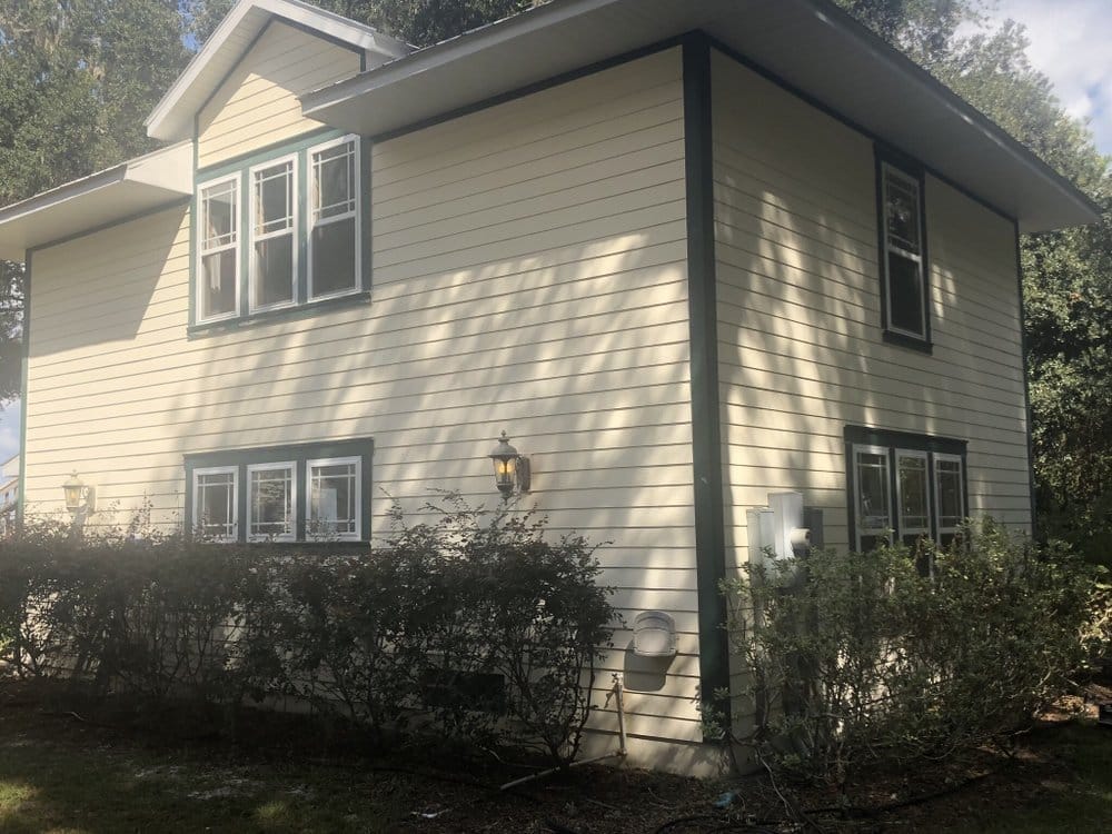Two-story side of porch home before repaint